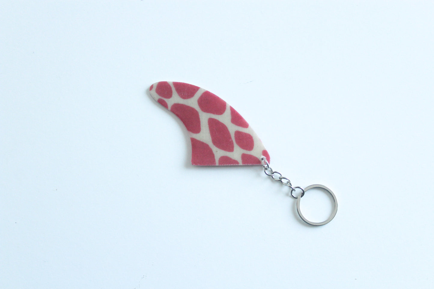 Fin shaped dinosaur key chain