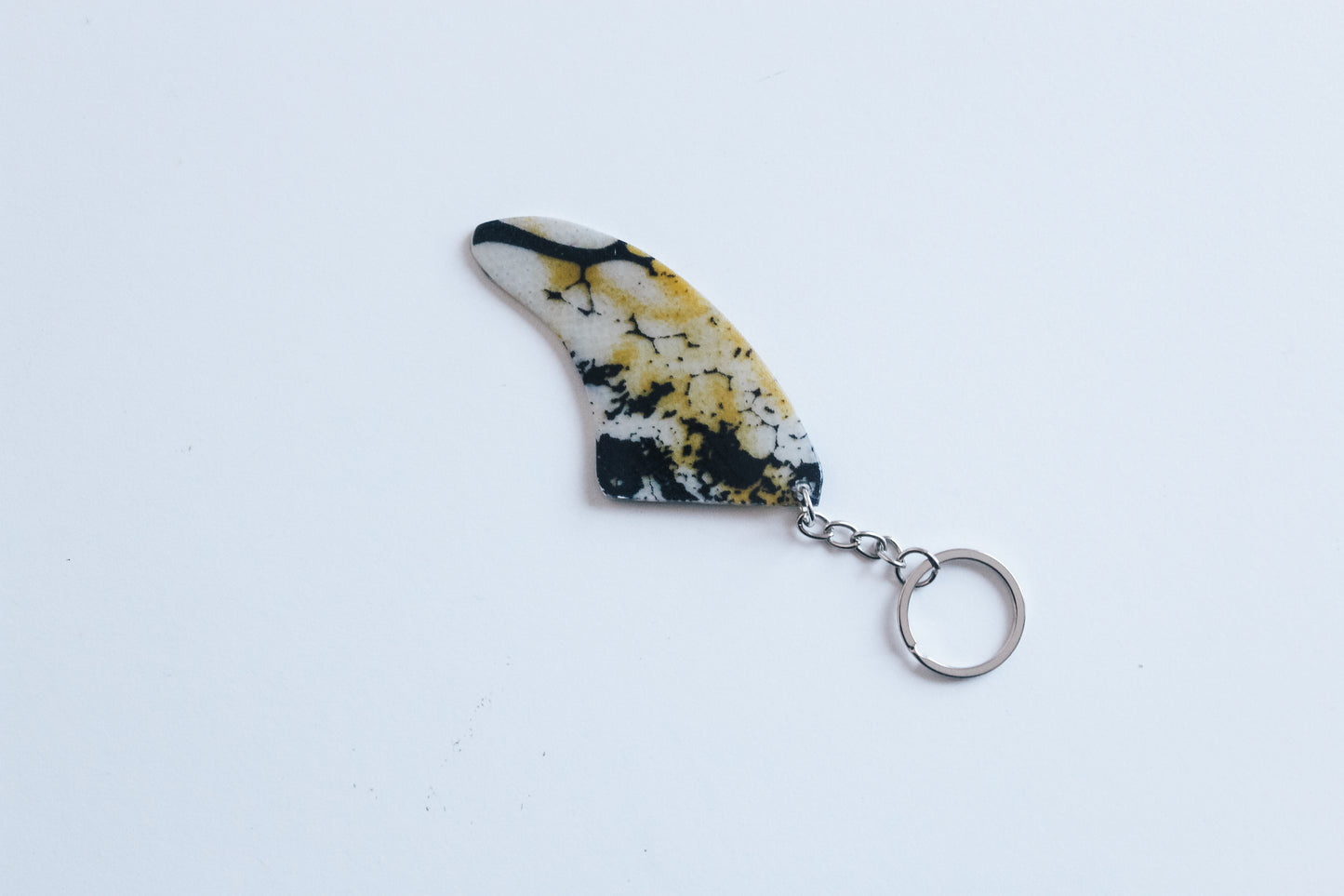 Fin shaped poison key chain