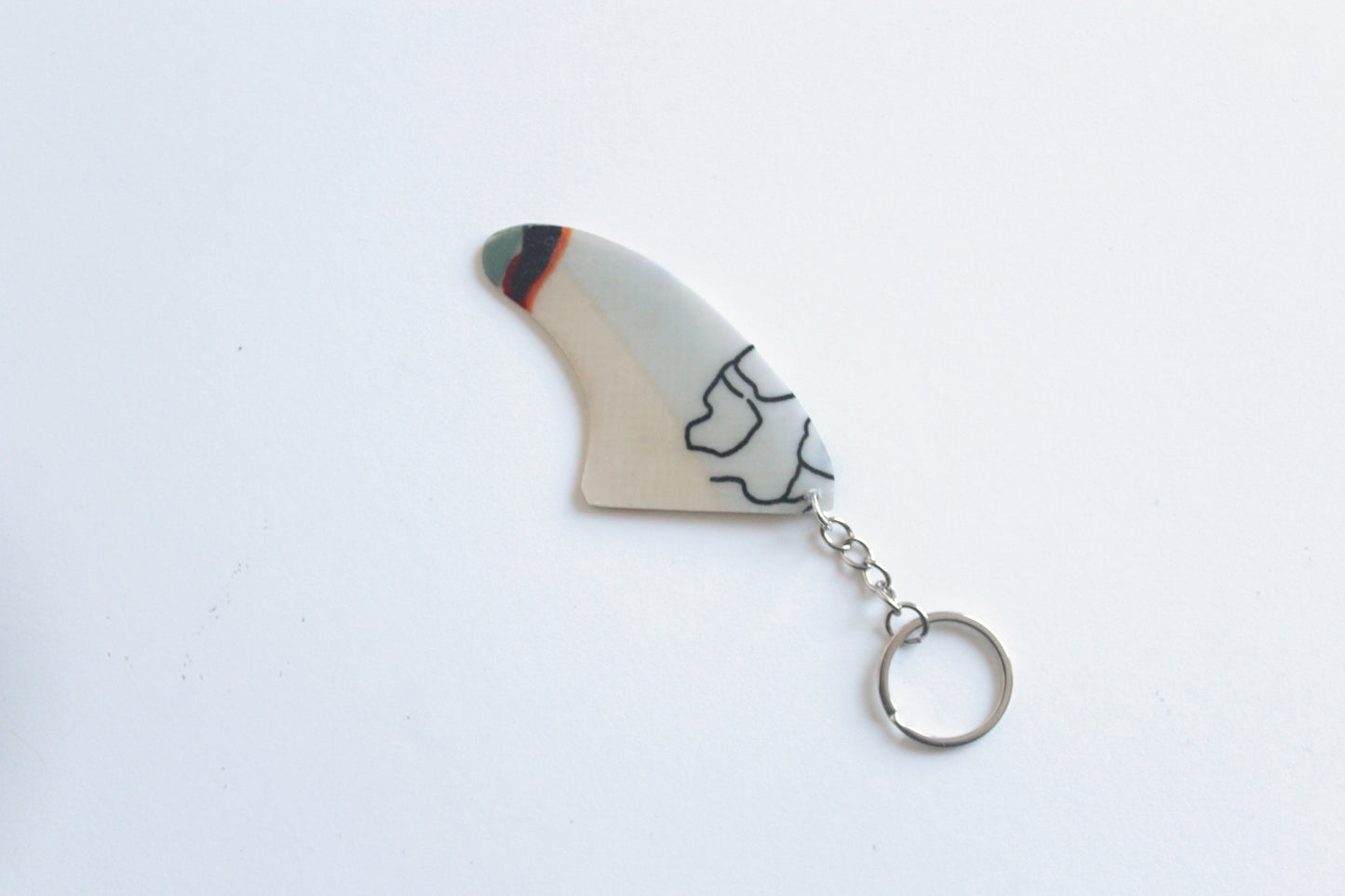 Fin shaped Picasso key chain