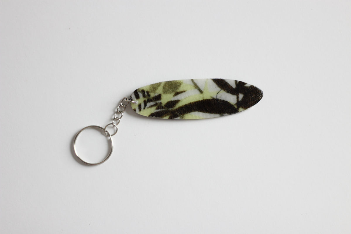 Surf shaped jungle key chain