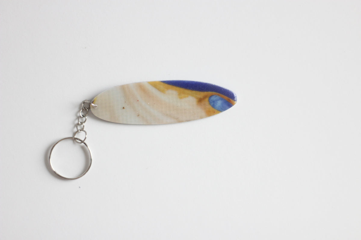Surf shaped marble key chain