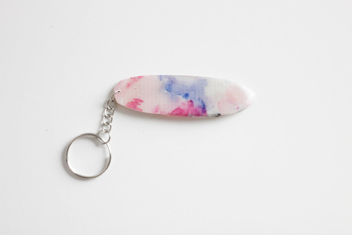 Surf shaped pastel key chain