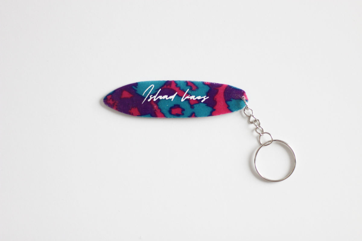 Surf shaped purple leopard key chain