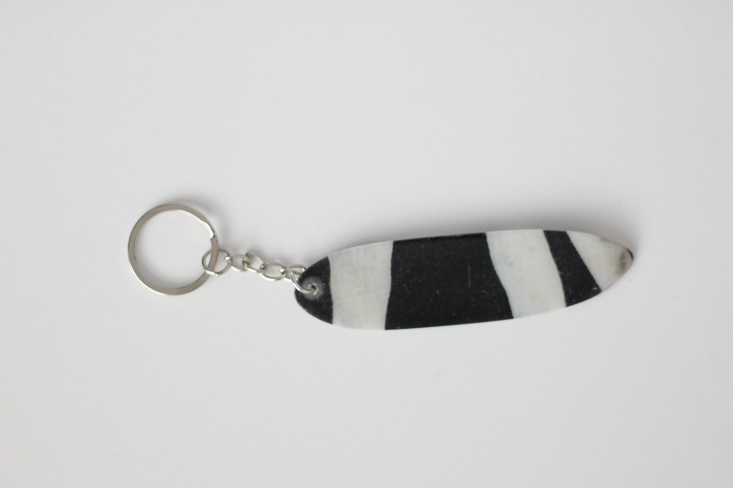Surf shaped zebra key chain