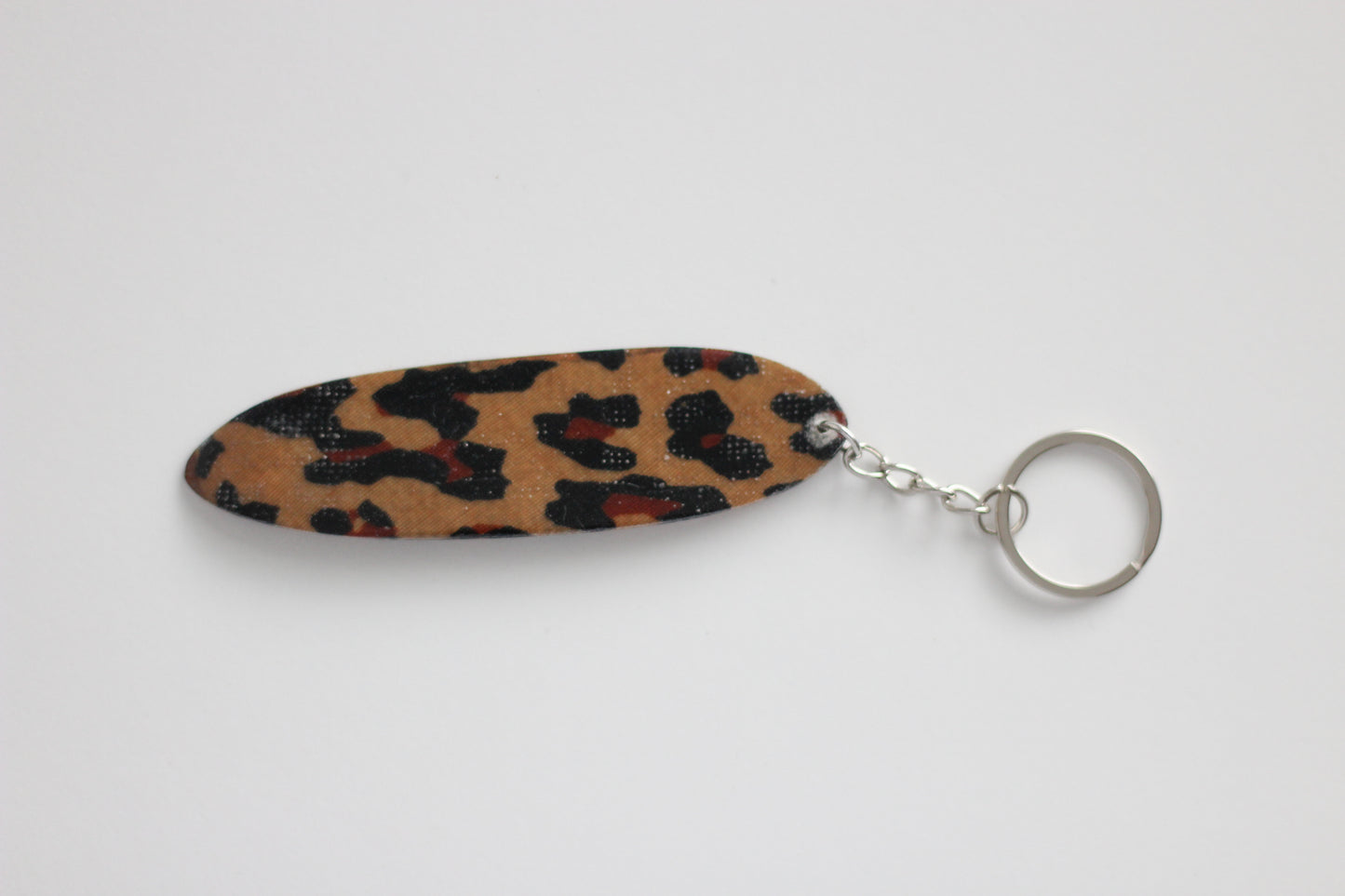 Surf shaped leopard key chain