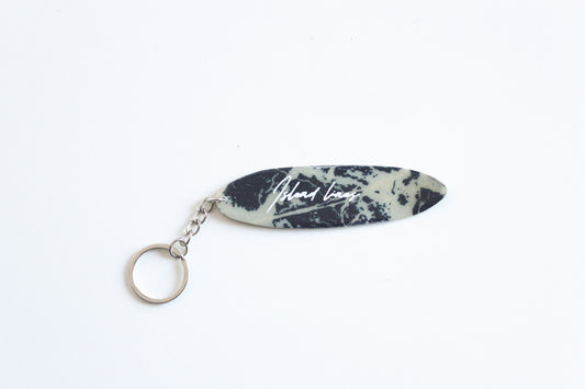 Surf shaped marble key chain