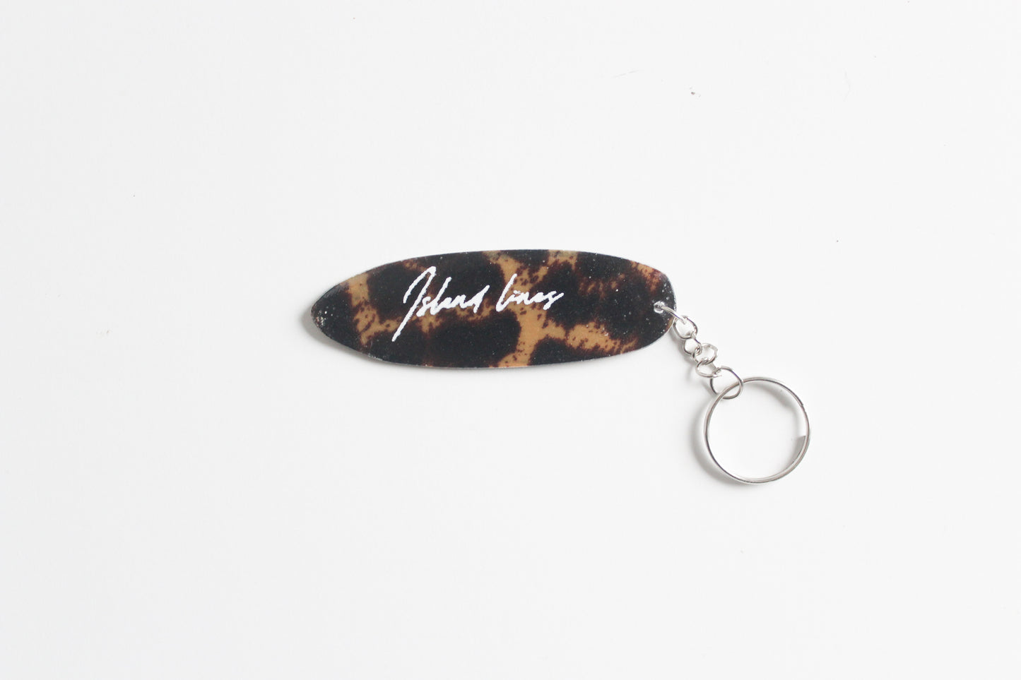 Fin shaped leopard key chain