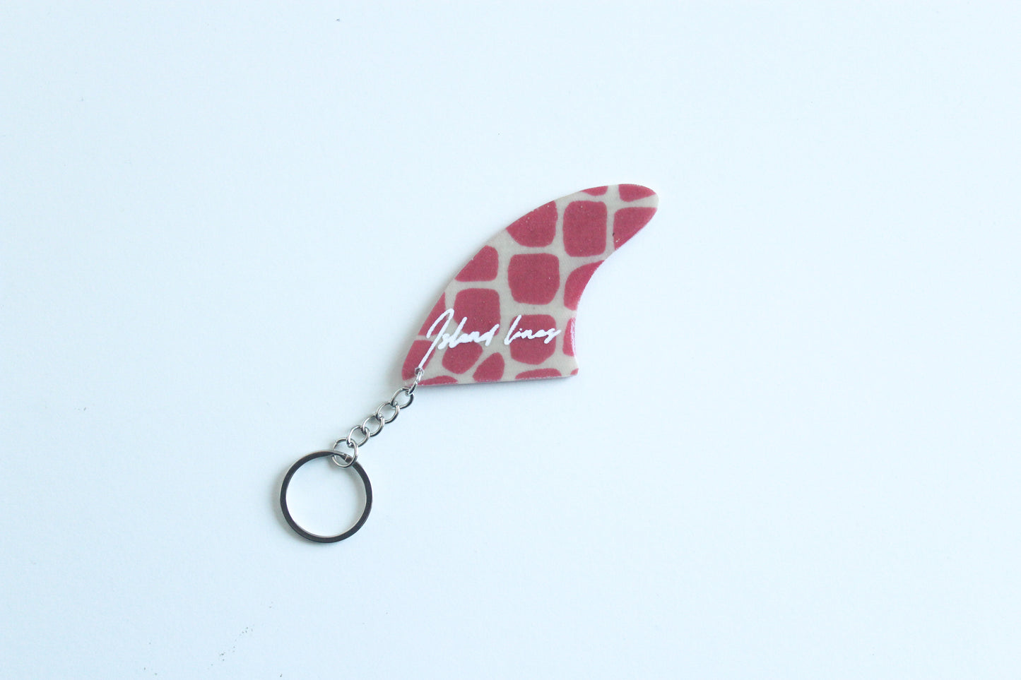 Fin shaped dinosaur key chain