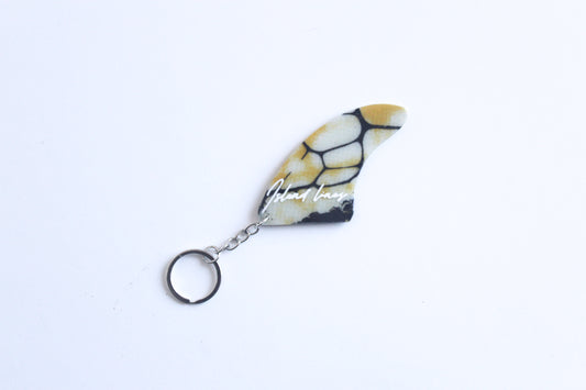 Fin shaped poison key chain