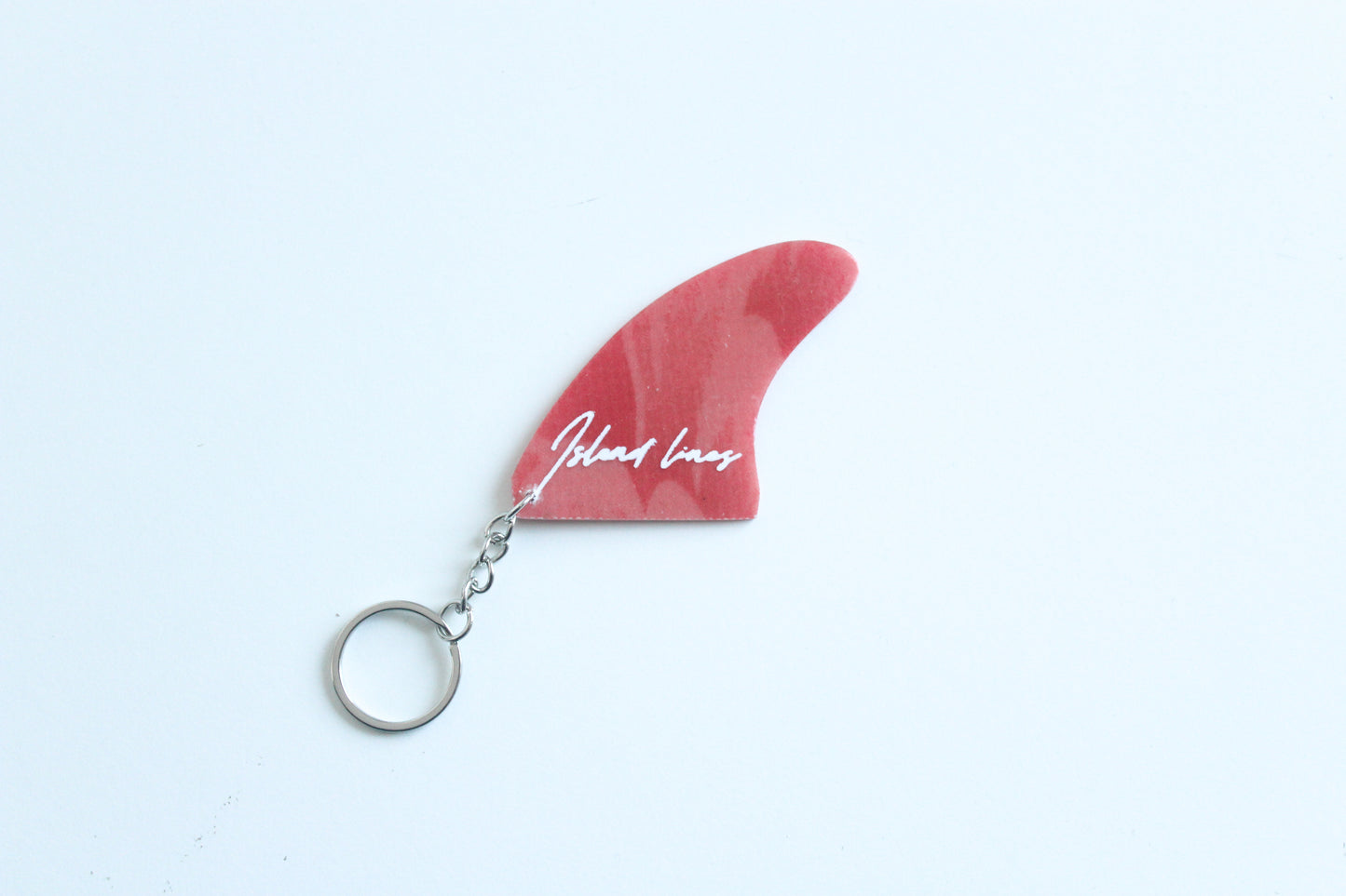 Fin shaped abstract key chain