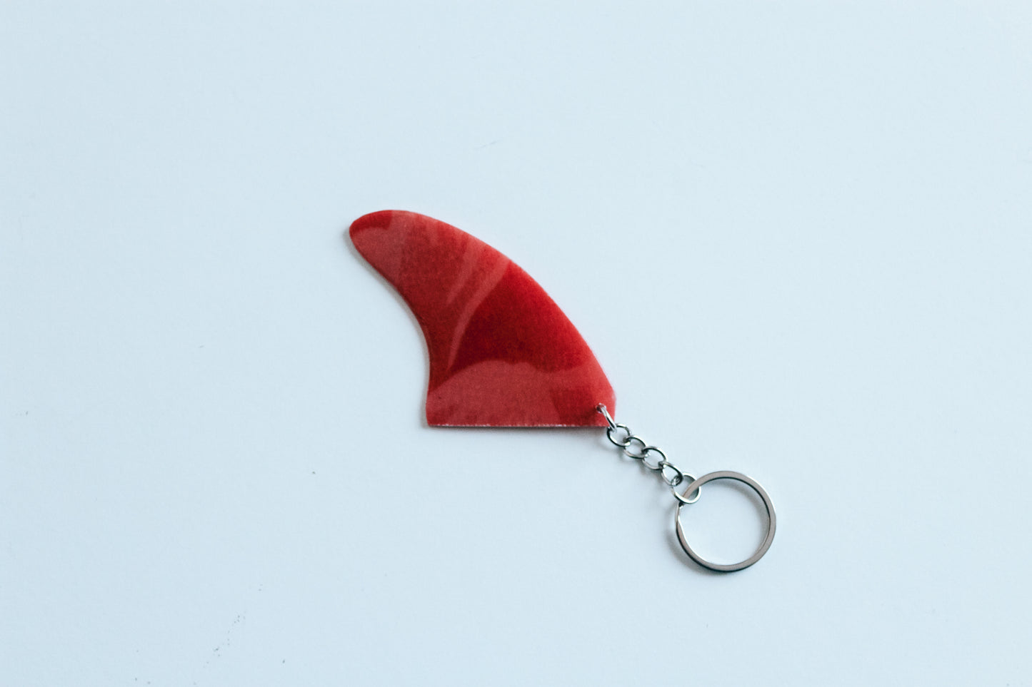 Fin shaped abstract key chain