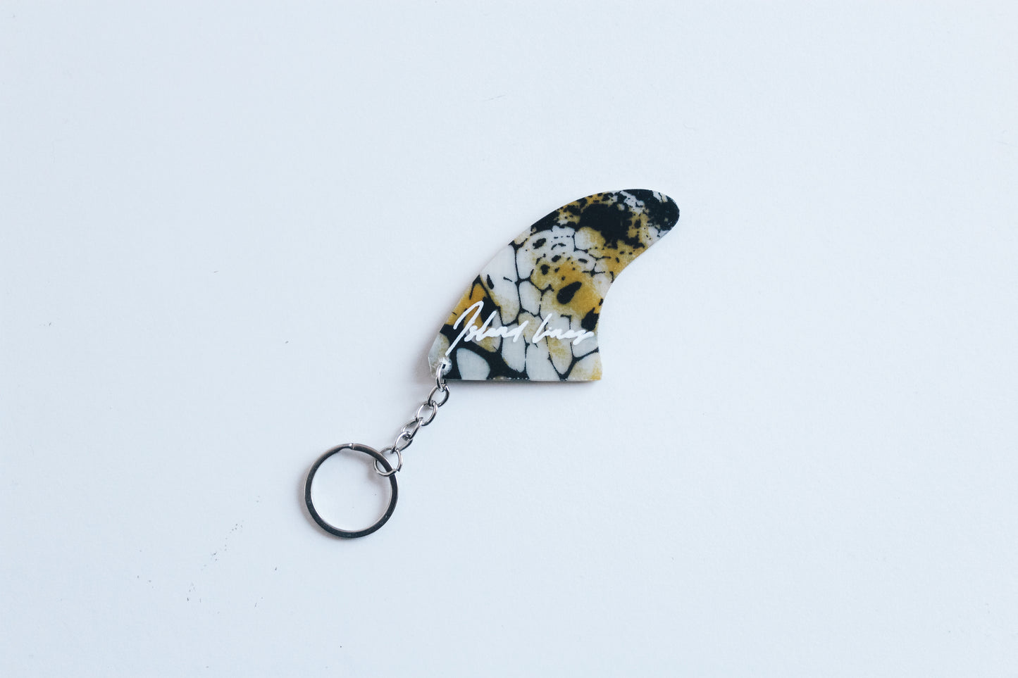Fin shaped poison key chain