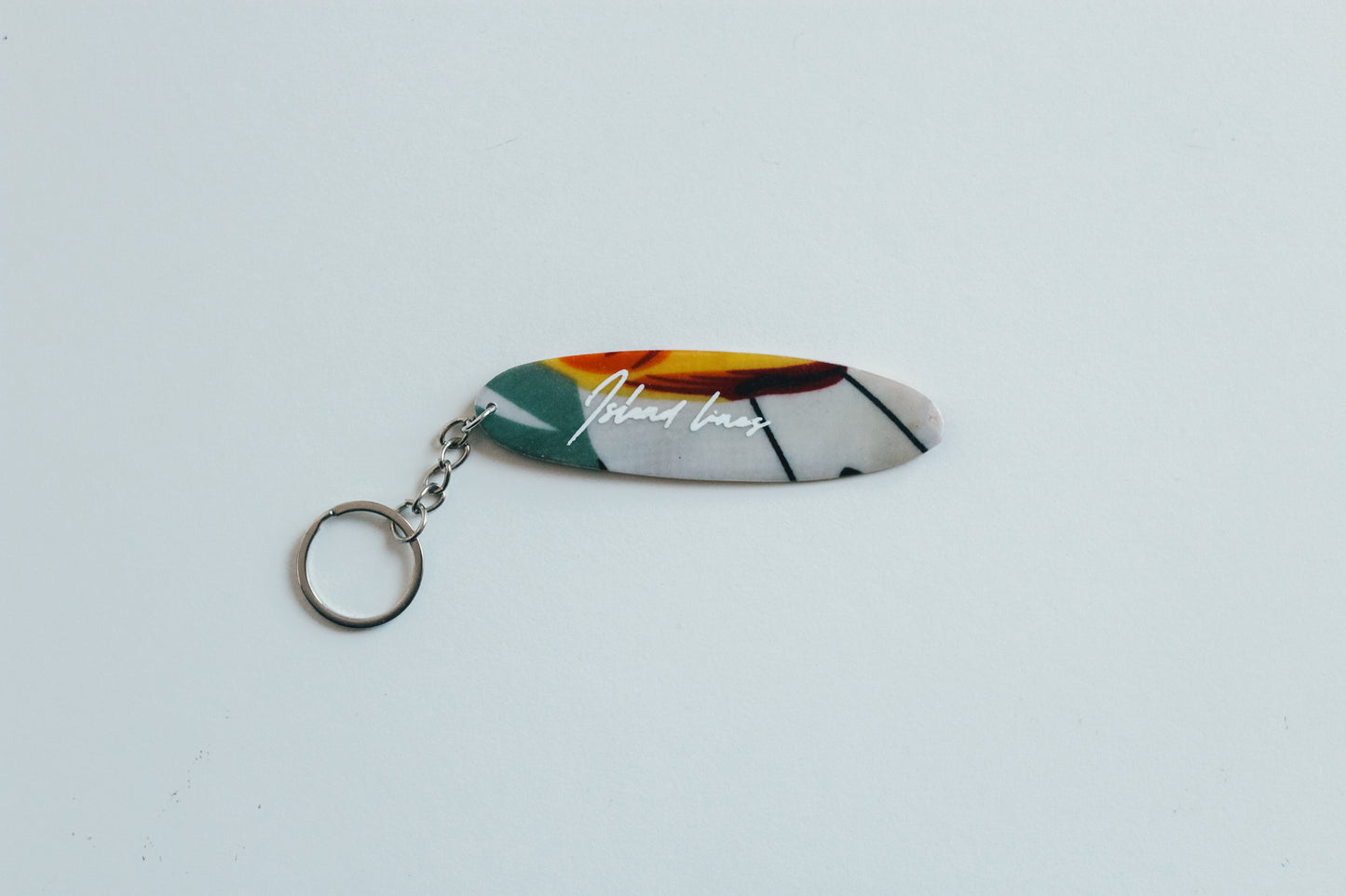 Surf shaped tropics key chain
