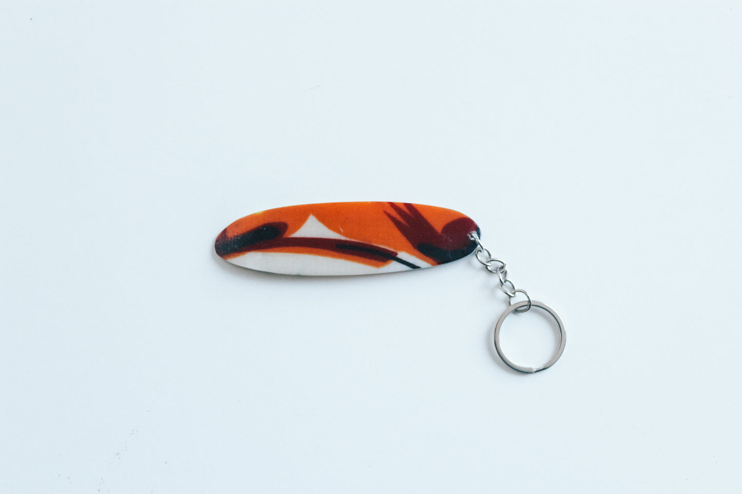 Surf shaped tropics key chain