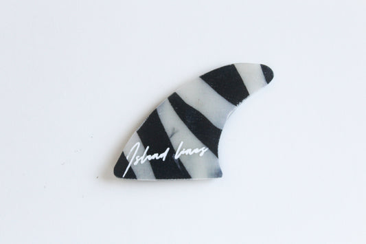 Fin shaped zebra magnet