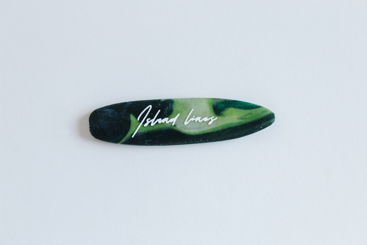Surf shaped green magnet