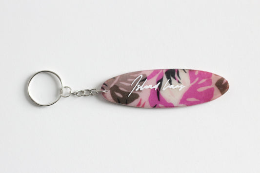 Surf shaped pink monstera key chain