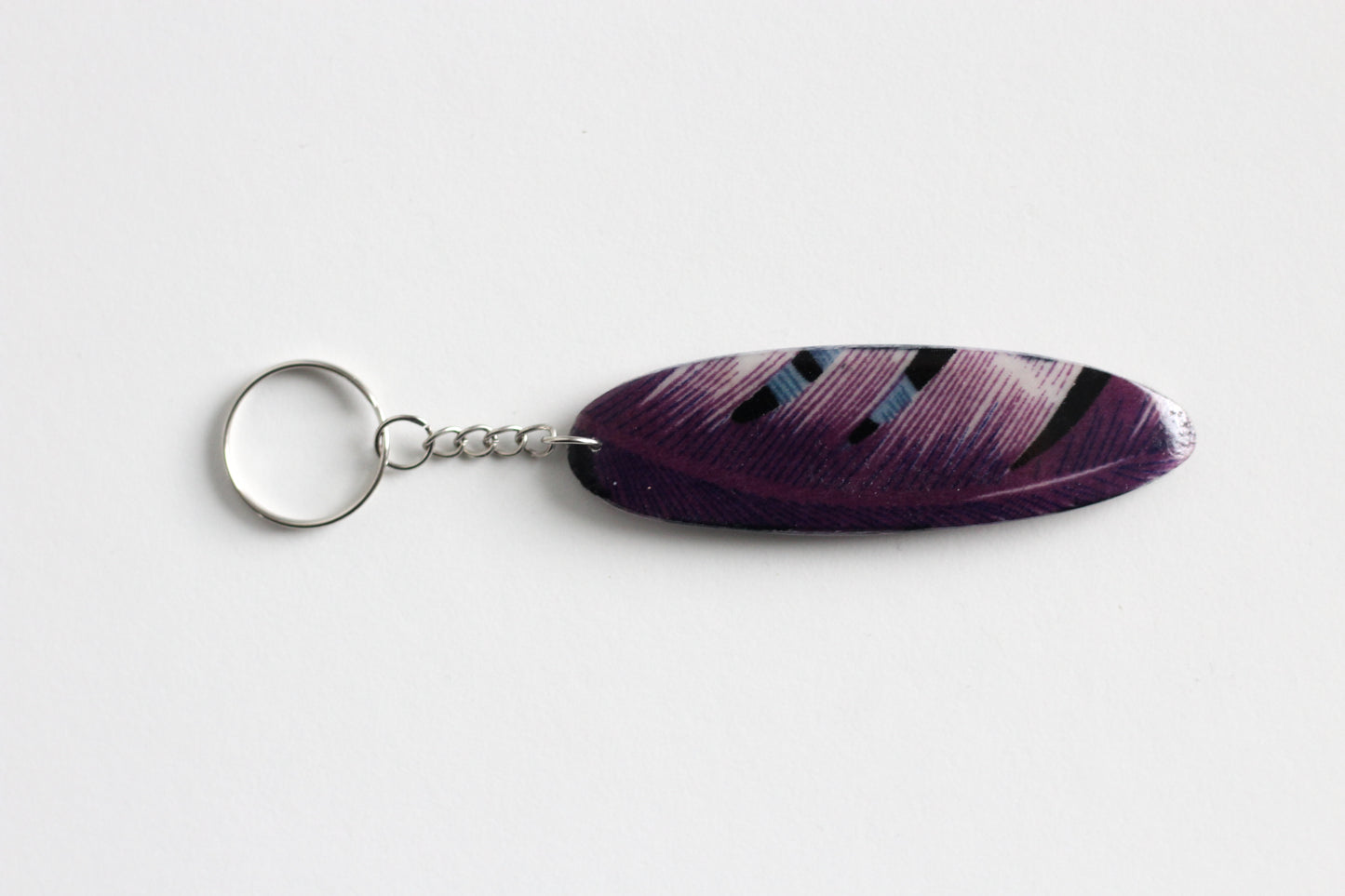 Surf shaped dark purple key chain