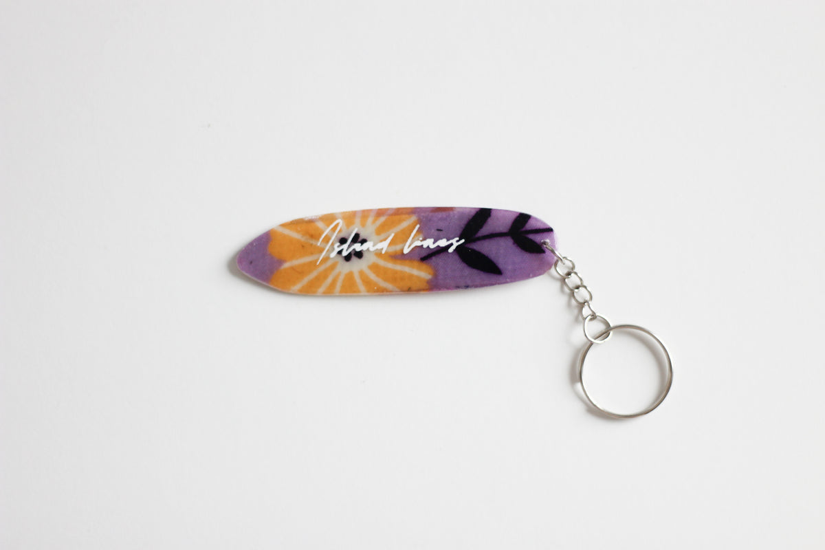 Surf shaped purple key chain