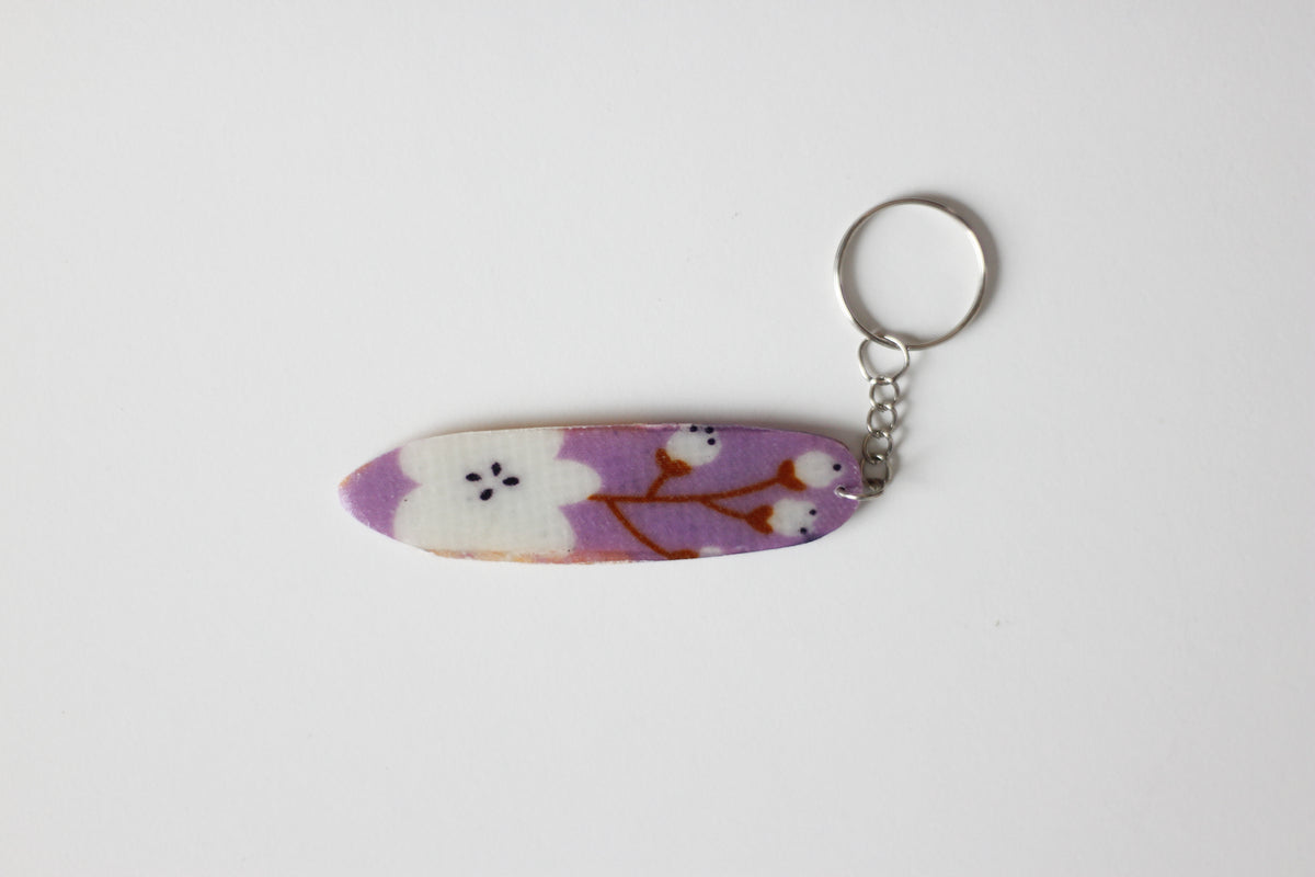 Surf shaped purple key chain