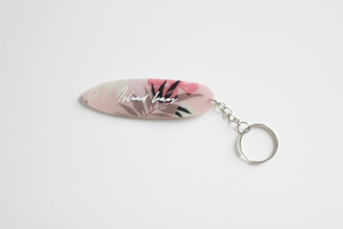 Surf shaped pink monstera key chain