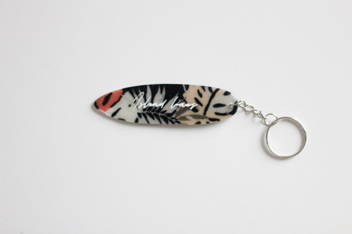 Surf shaped dark monstera key chain