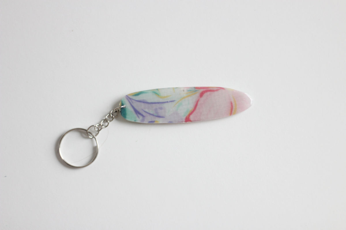 Surf shaped pastel key chain