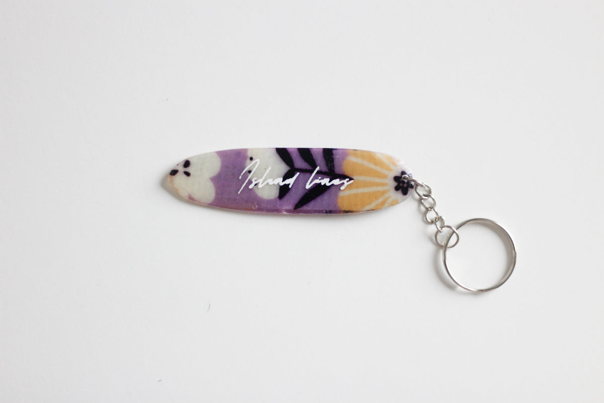 Surf shaped purple key chain