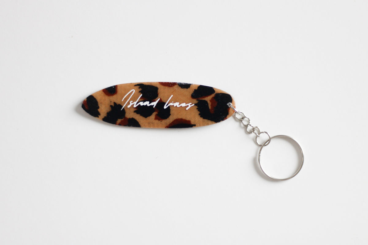 Surf shaped leopard key chain